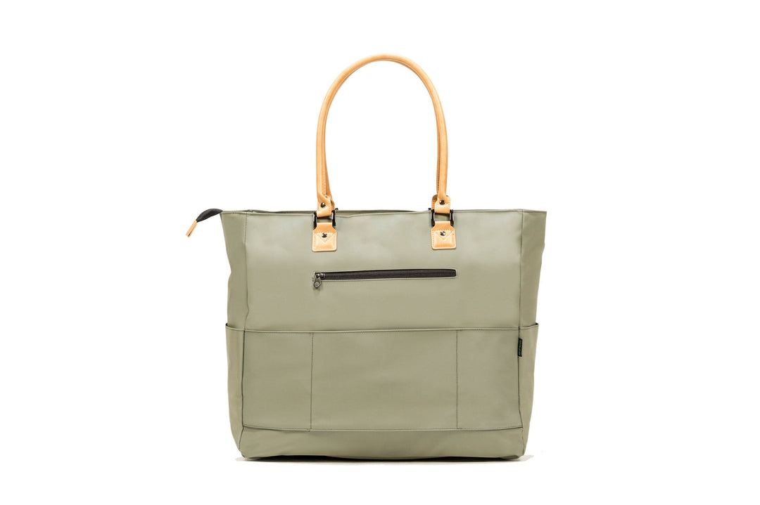PKG Georgian 33L recycled tote bag in olive green, featuring faux leather handles and multiple pockets for travel convenience.