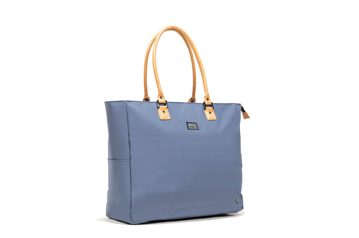 PKG Georgian 33L recycled tote bag in blue with faux leather accents and padded base, ideal for travel and overnight trips.