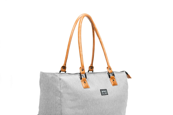 PKG Georgian 33L tote bag with brown faux leather handles and grey fabric, ideal for travel and overnight trips.