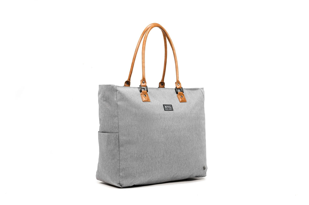 PKG Georgian 33L recycled tote bag in gray with faux leather handles, ideal for travel and overnight trips.