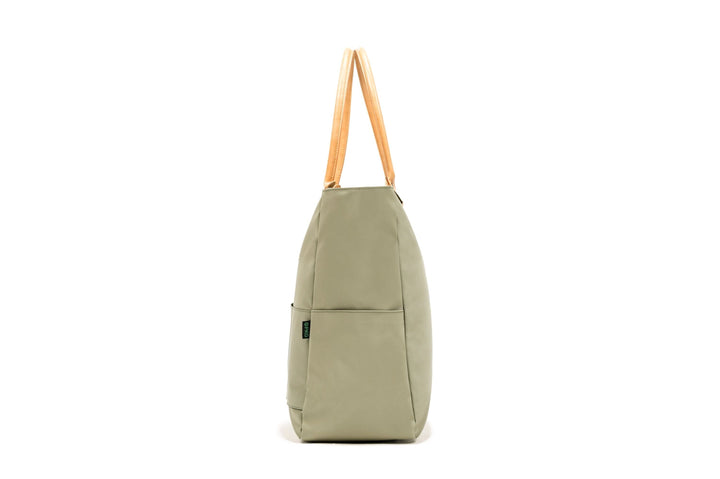 PKG Georgian Recycled 33L Tote Bag in light green with wooden handles, ideal for travel and everyday use.