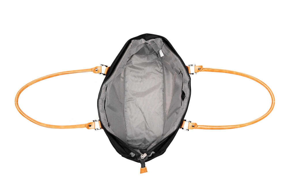 View of the interior of the PKG Georgian 33L tote bag showcasing the striped lining and faux leather straps.
