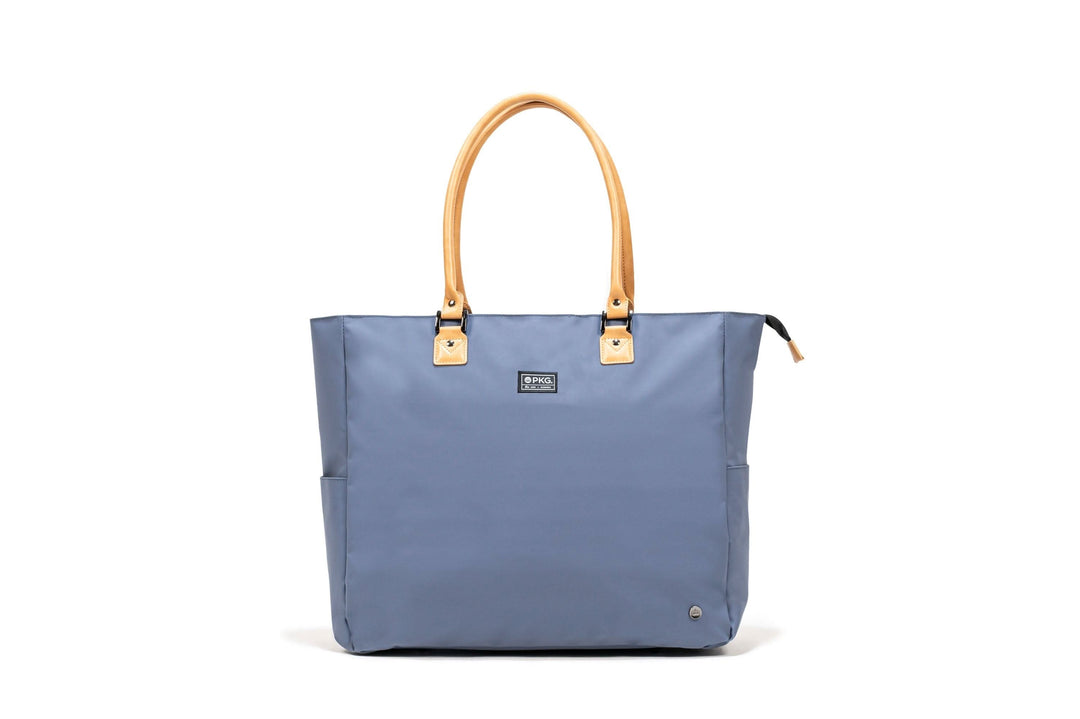 PKG Georgian Recycled 33L Tote Bag in blue with tan leather handles and accents, ideal for travel and everyday use.