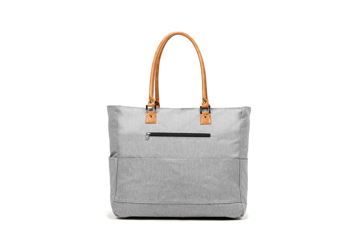 PKG Georgian 33L tote bag with faux leather accents, weather-resistant fabric, and padded base for travel.