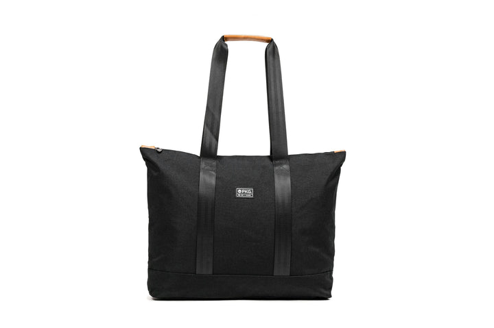PKG Lawrence 16L tote bag in black with sleek design and sturdy straps, perfect for everyday use.