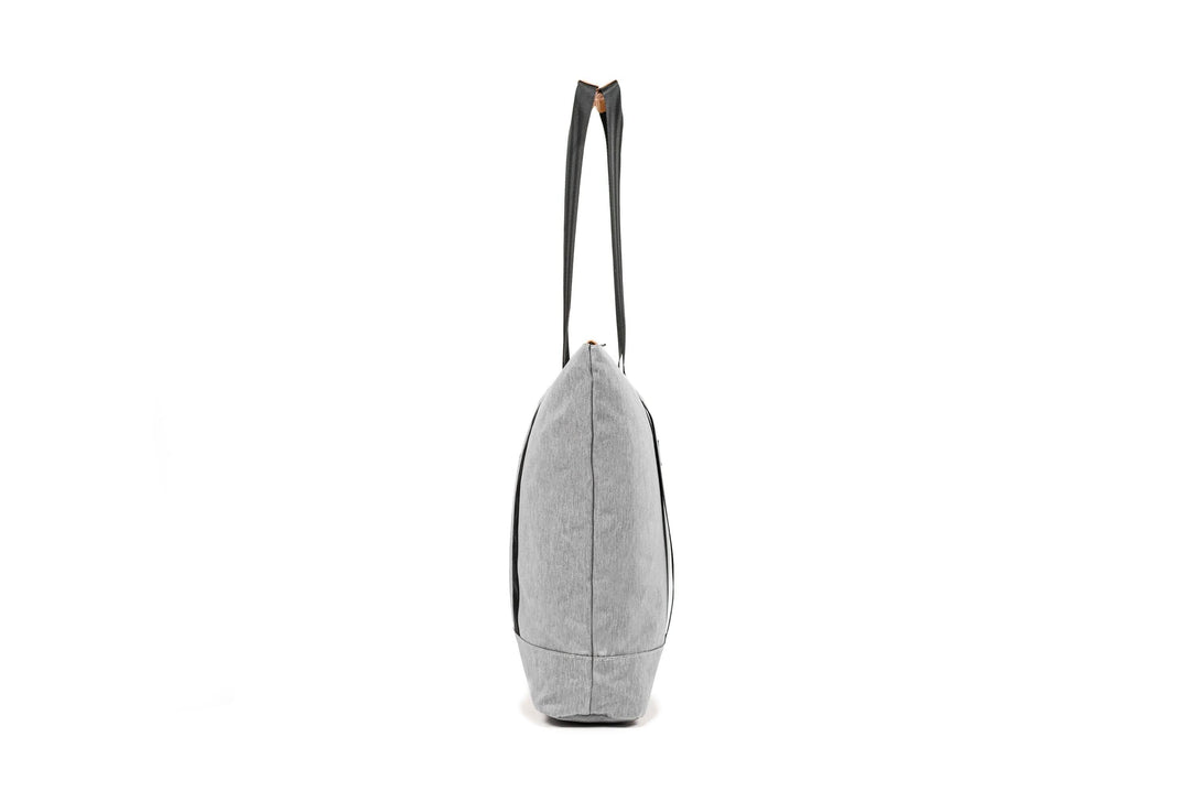 PKG Lawrence 16L Tote Bag in gray with sturdy straps, showcasing a side view and sleek, weather-resistant design.