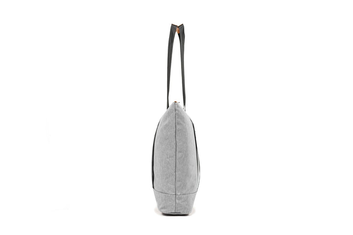 PKG Lawrence 16L Tote Bag in gray with sturdy straps, showcasing a side view and sleek, weather-resistant design.
