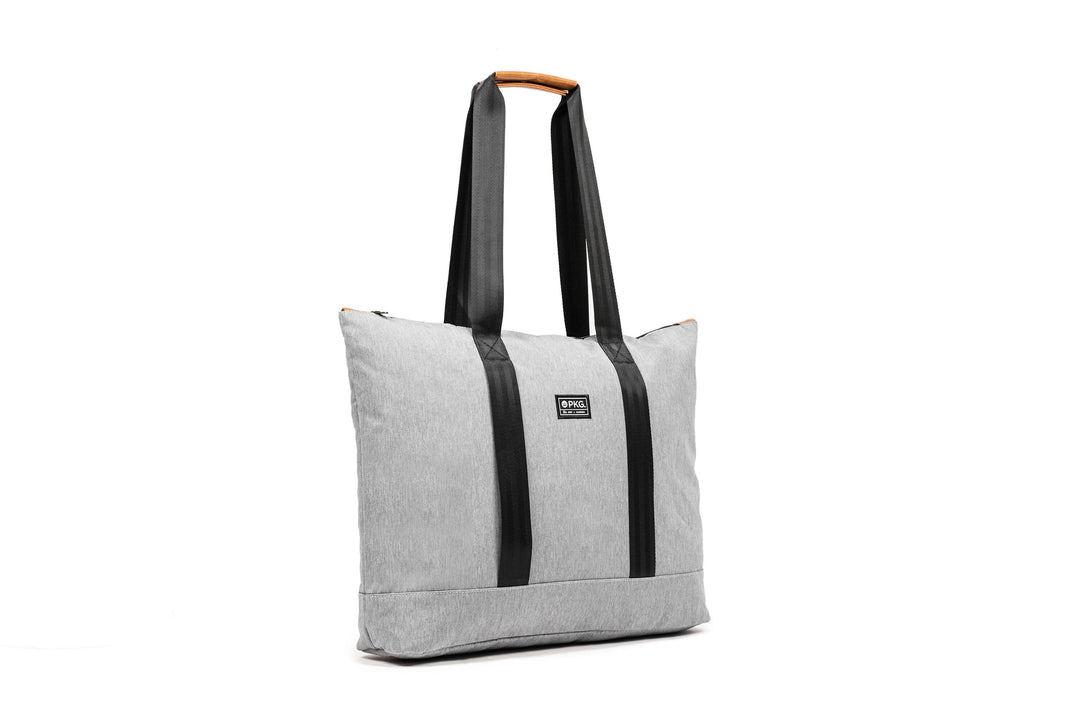 PKG Lawrence 16L tote bag in gray, stylish design with sturdy black straps, perfect for everyday use.