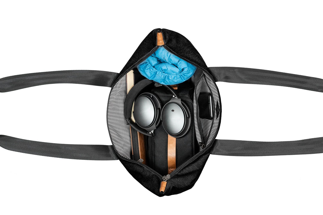 Interior view of PKG Lawrence 16L tote bag showcasing organized items like goggles and clothing.