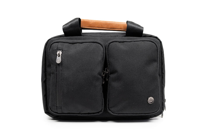 PKG Simcoe recycled essentials bag with zipper pockets and leather handle, ideal for organizing toiletries.