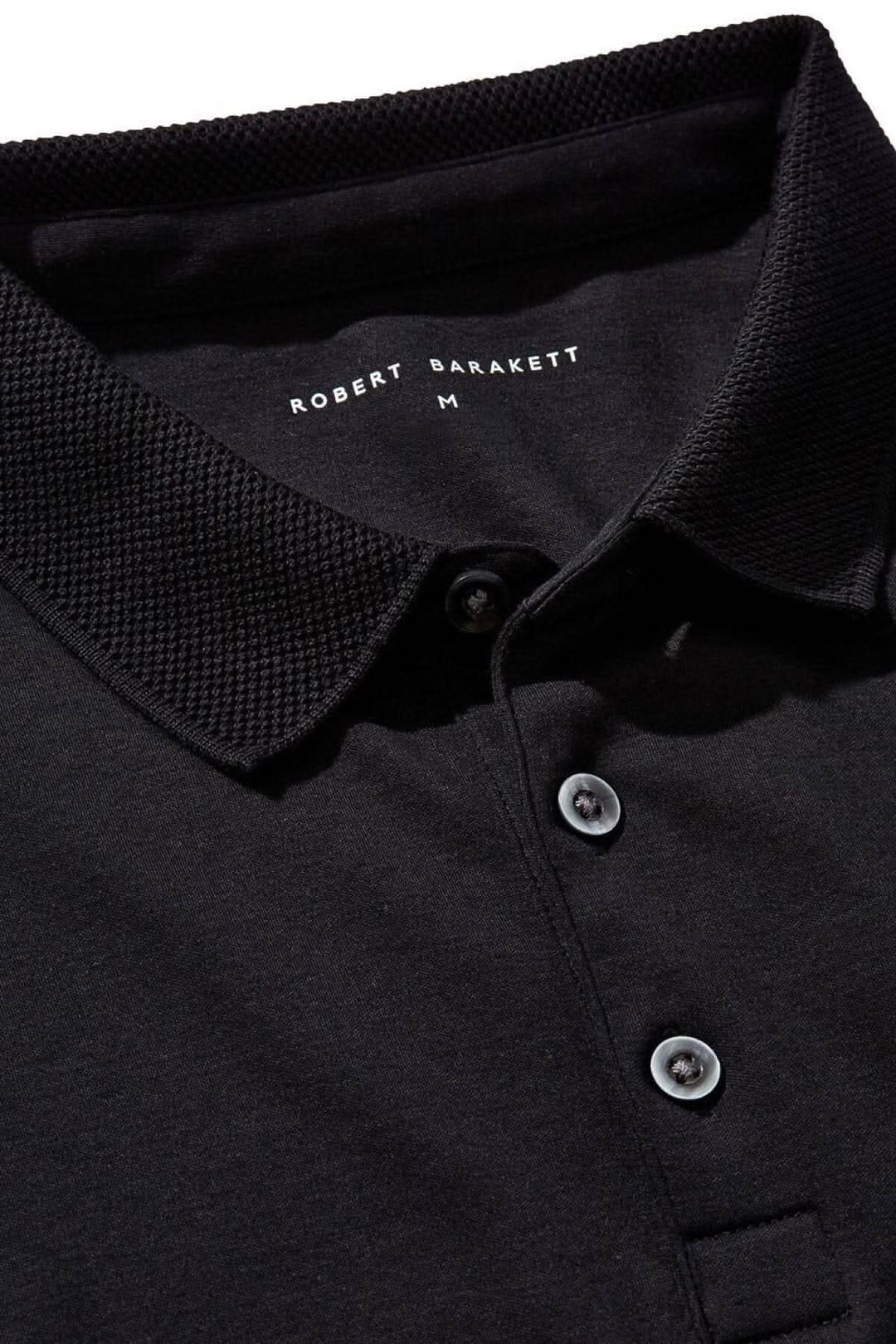 Polo Georgia noir de Robert Barakett avec col en maille nid d'abeille et boutons.