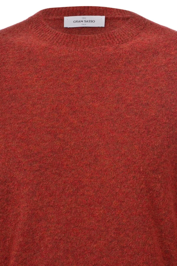 Pull en laine texturé orange de Gran Sasso, col rond, parfait pour les journées froides.
