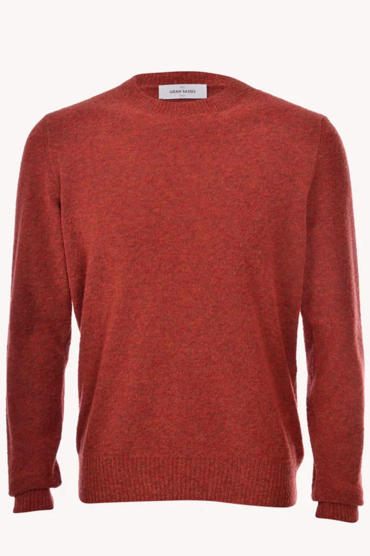 Pull texturé en laine rouge-orange, col rond, manches longues, parfait pour le temps froid.