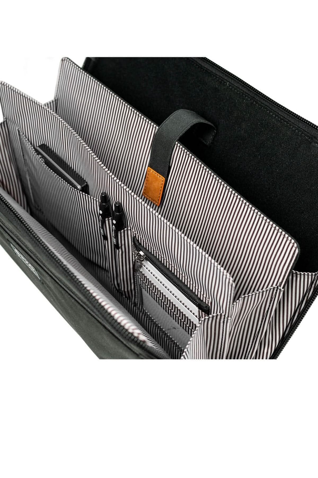 Intérieur du sac messager accordéon Wellington 10L avec organisation pour ordinateur et accessoires.