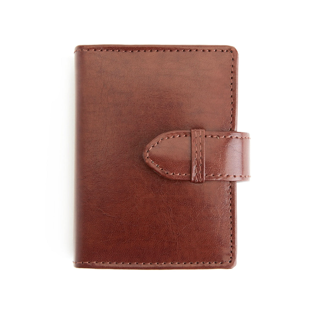 Brown leather card case with belt loop closure for easy access and premium quality craftsmanship.