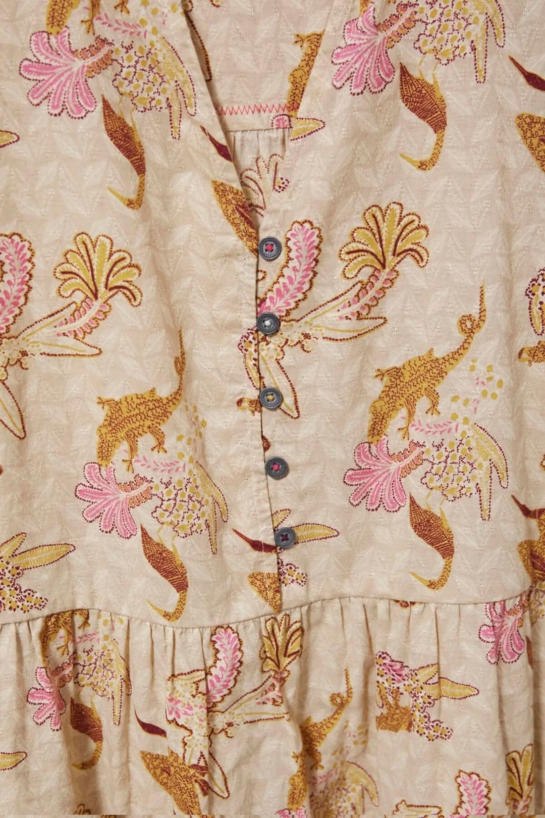Tunique Daphnée au motif floral, col en V, boutons et coupe décontractée en viscose douce.
