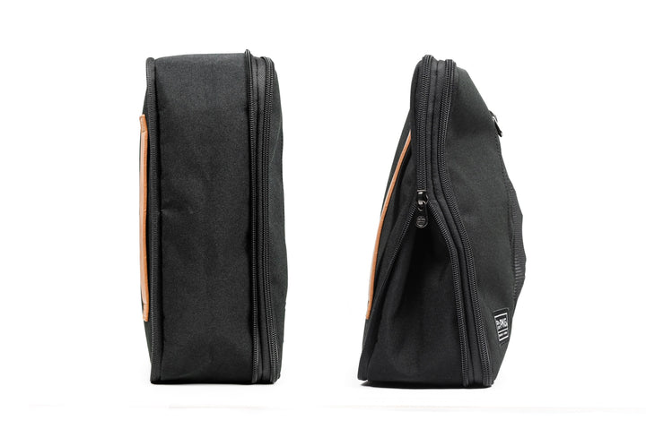 UNION Recycled Compression Packing Cubes in black, showcasing two sizes with zippered compression for efficient packing.