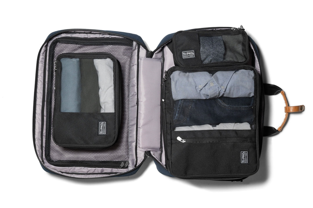 Union Recycled Compression Packing Cubes open, showcasing organized clothing and laundry/shoe bag for efficient packing.